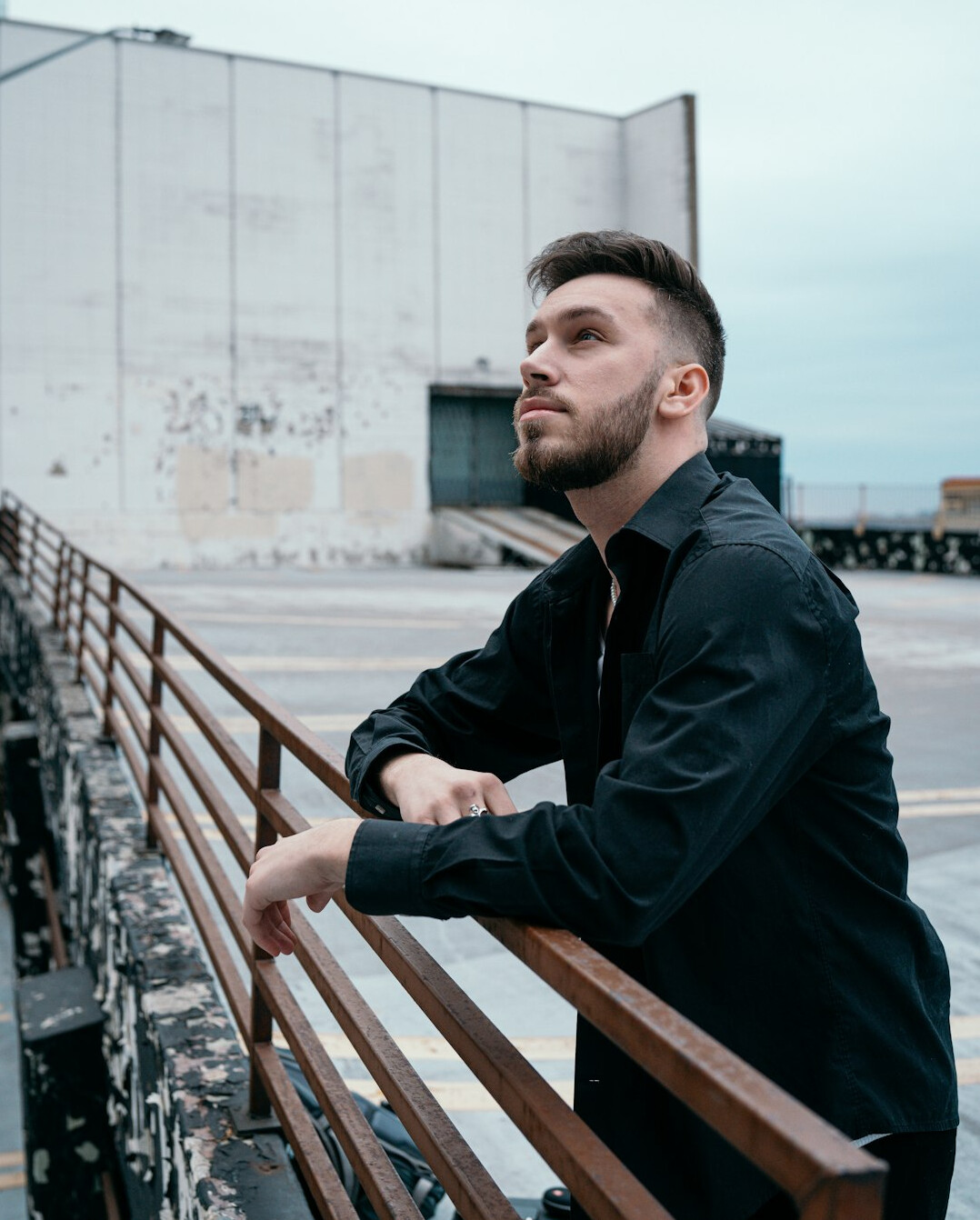 Confident man with a short beard in a casual shirt