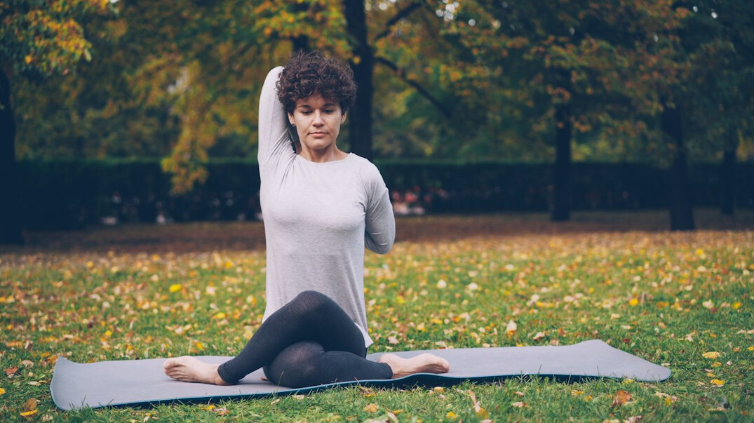 woman doing yoga outdoors